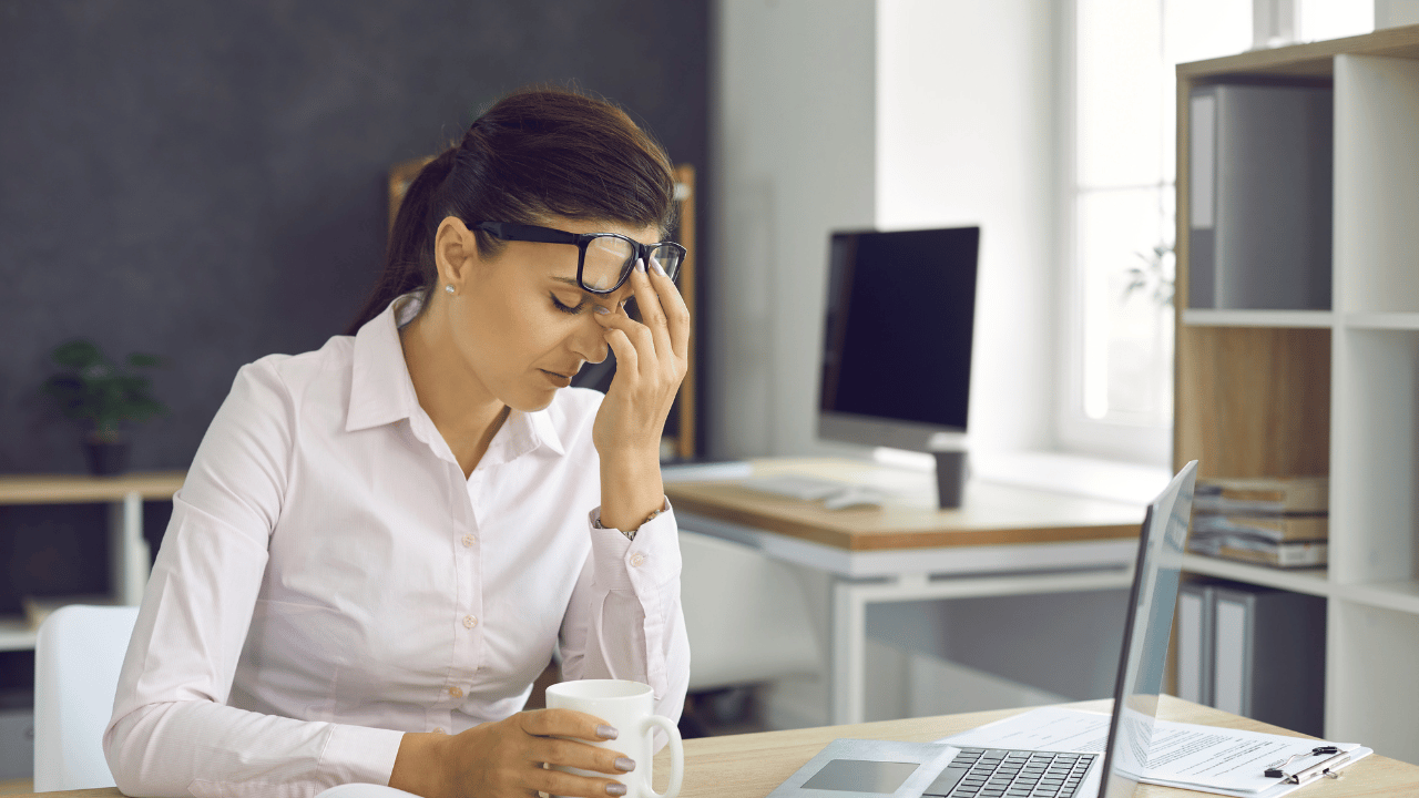 Troubled Business Woman thinking of how she can approach her employee for his low performances, and have that awkward difficult conversation.