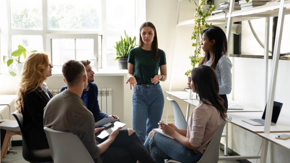 Business owner having group meetings in development reviews of employees