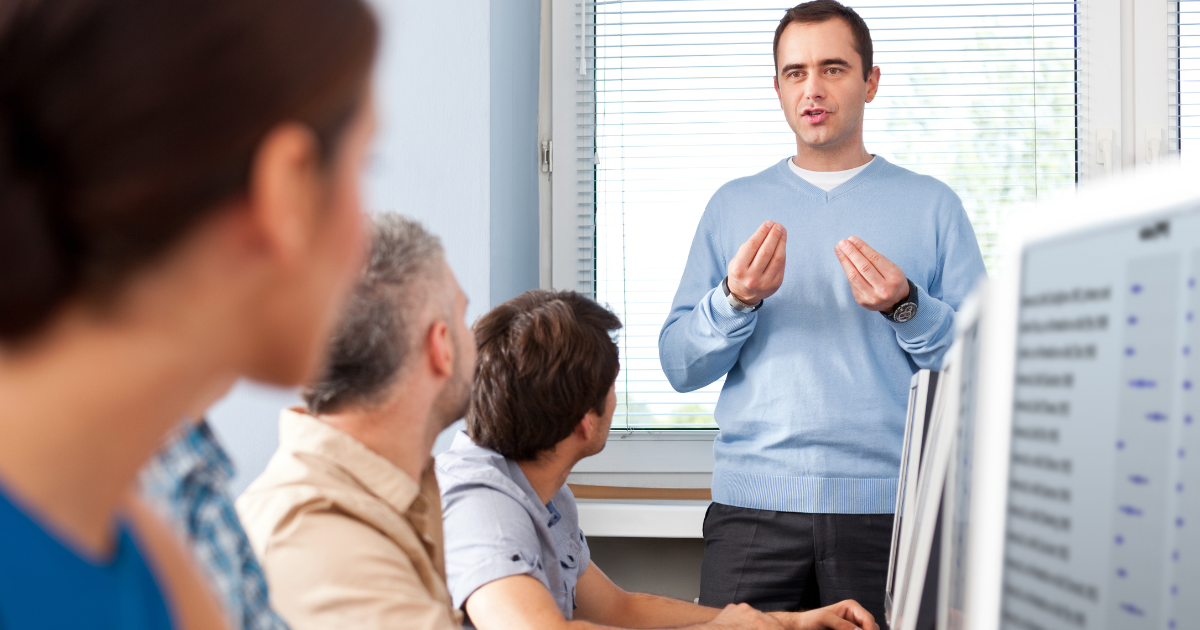 Business owner Training his employee on a computer inside and office