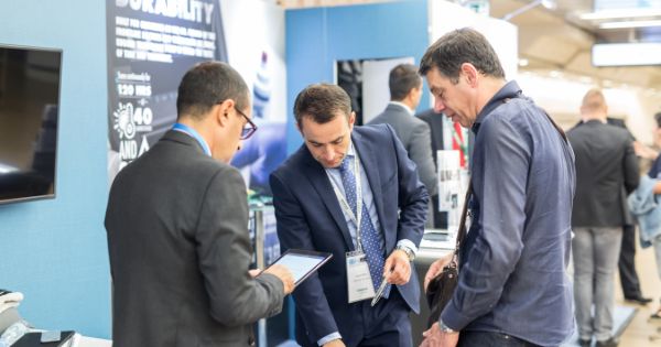 A group of customer looking around in a business expo