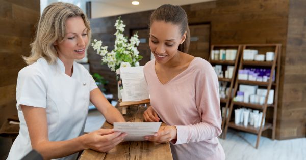 A business employee explaining the business products to a woman customer