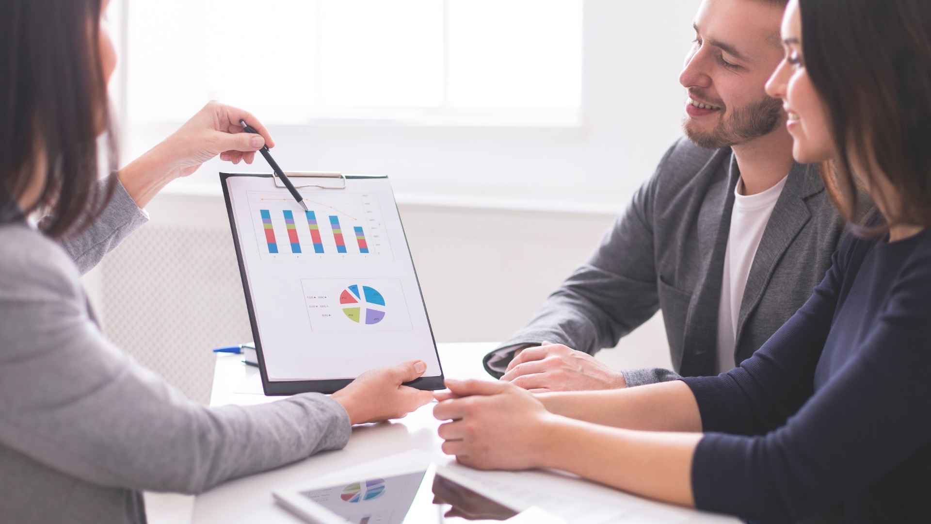 finances Business owner together with his employee discussing what is virtual profit sharing in a table with white board