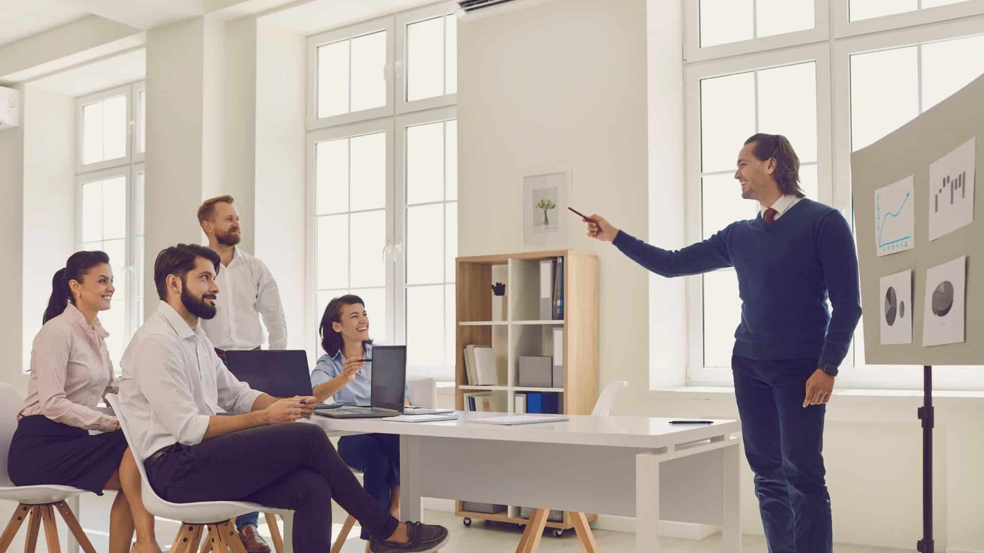 suggestion (1) business team meeting in an office talking about open book management