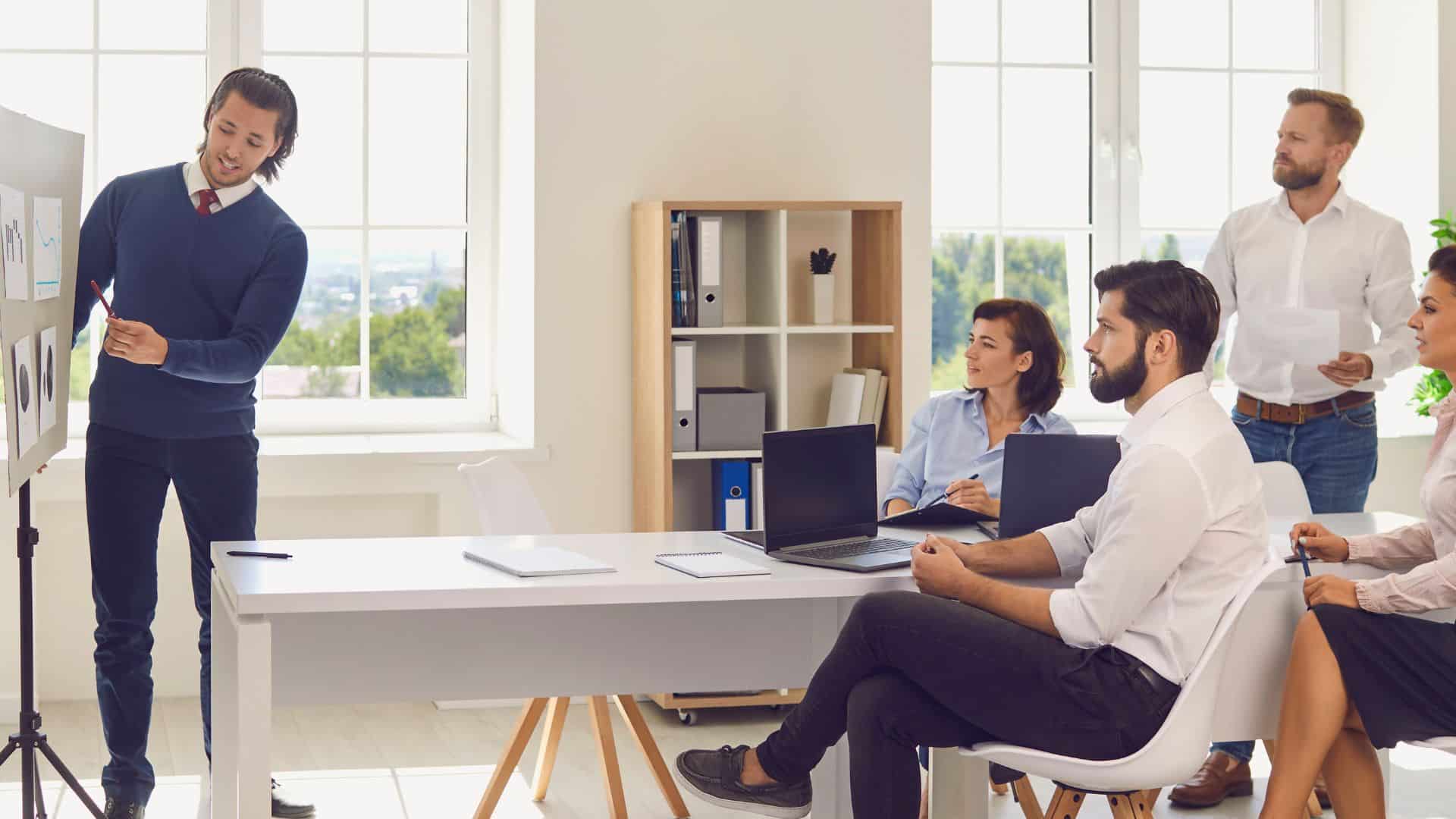 suggestion team business team meeting in an office talking about open book management