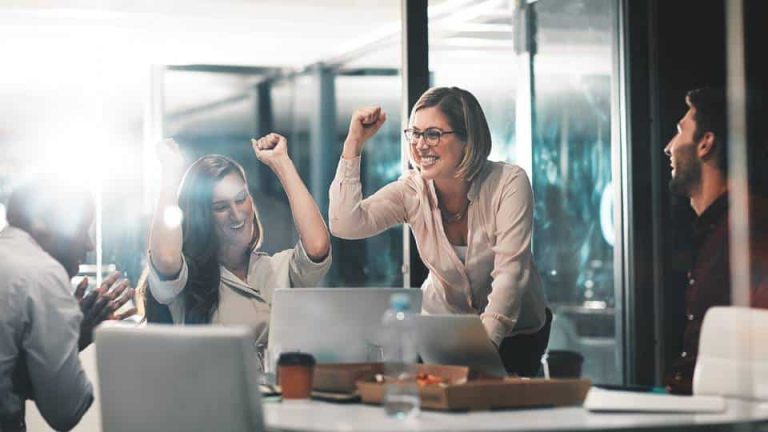 Team celebrating in an office